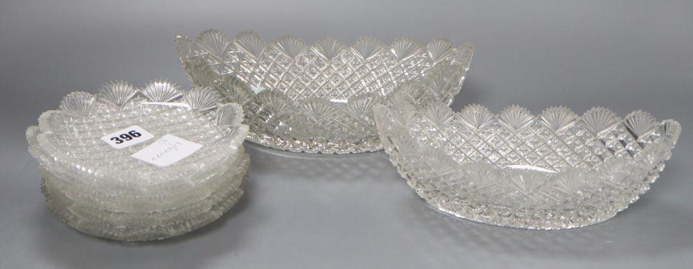 A set of five circular cut glass ice cream dishes and two matching oval bowls